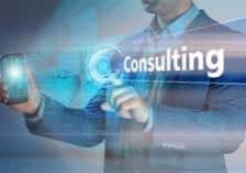 Business concept. Businessman holding smatrfon and click on the virtual display with text consulting